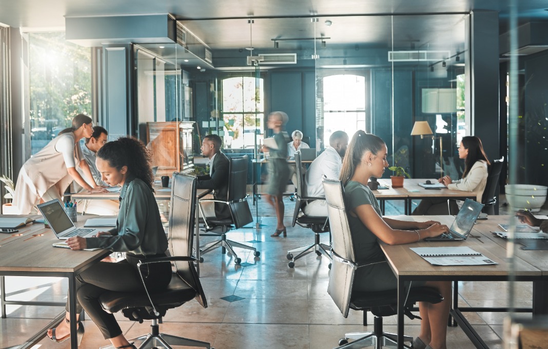 Corporate business people working in busy marketing office space