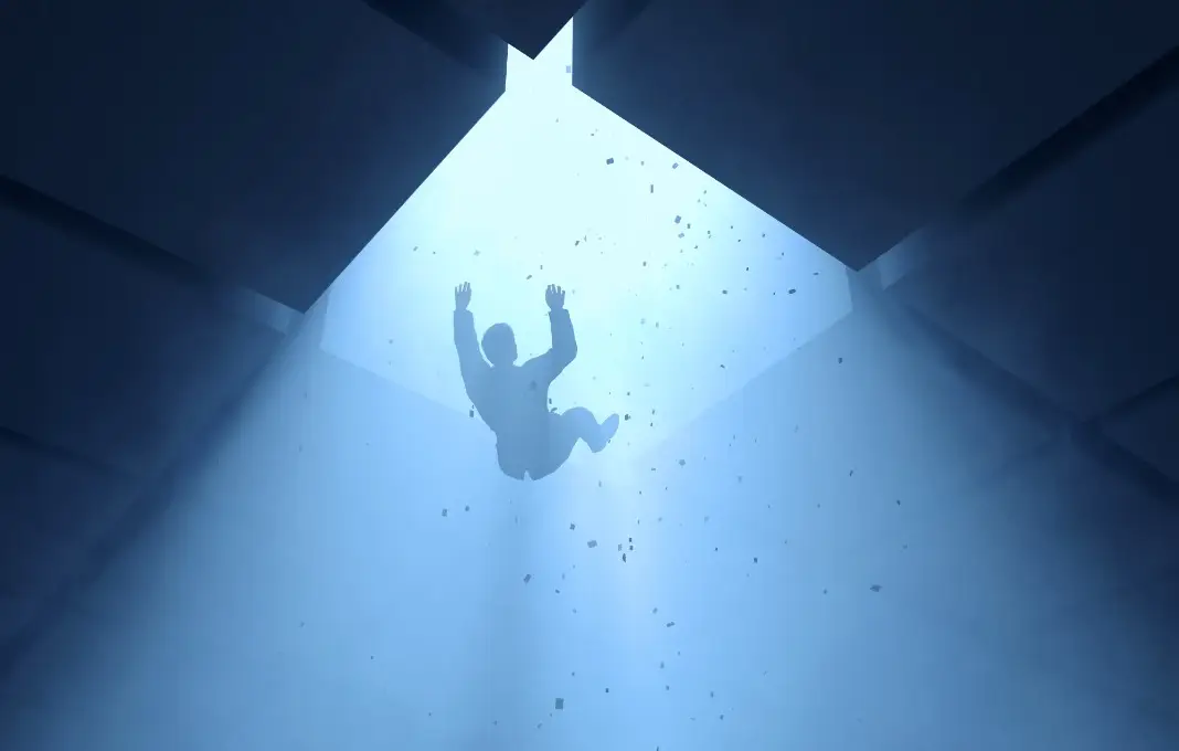 man falling into a hole