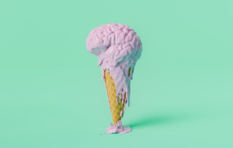 Melting Brain-Shaped Ice Cream on Cone Against Mint Background