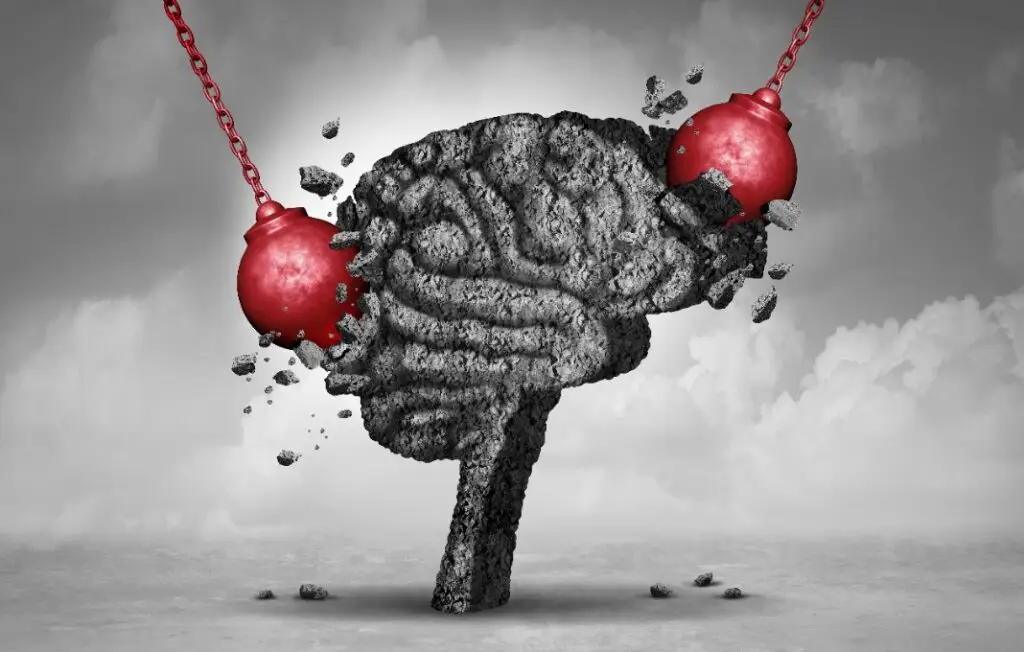 Wrecking balls knocking into brain made out of stone